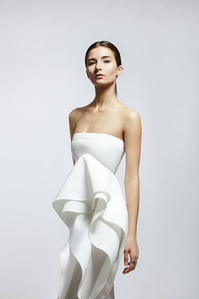 woman wearing white dress - fashion stock pictures, royalty-free photos & images