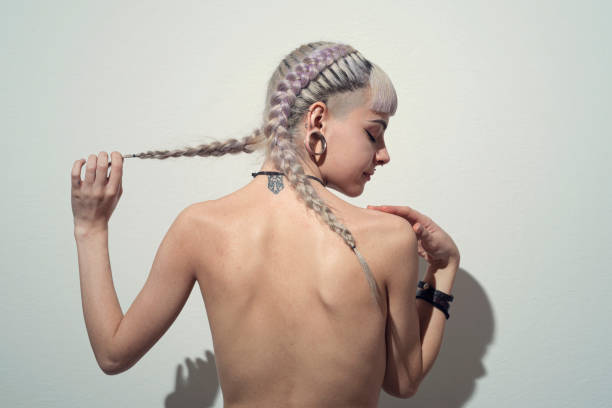 woman with braids and dyed hair - hairstyle stock pictures, royalty-free photos & images