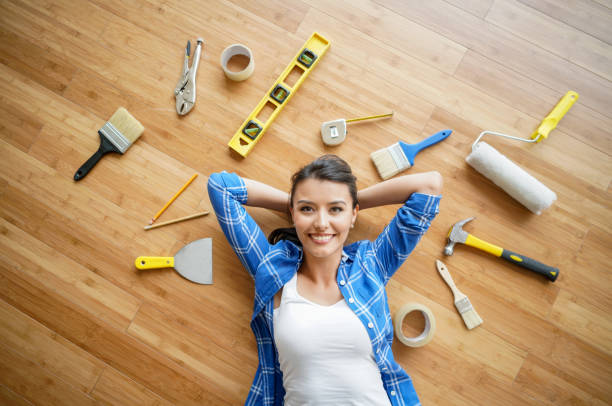 woman working on a housing project - home decoration stock pictures, royalty-free photos & images
