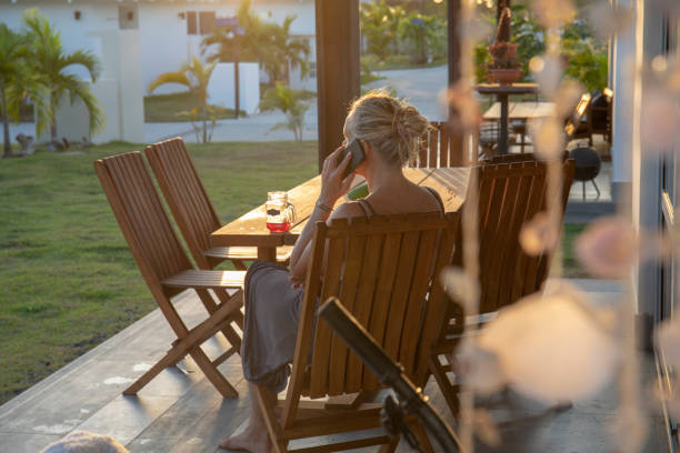 woman works from home on outdoor patio in the morning - garden decoration stock pictures, royalty-free photos & images