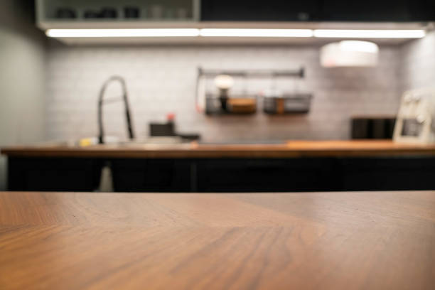 wood table top on blur kitchen counter (room)background. - food stock pictures, royalty-free photos & images