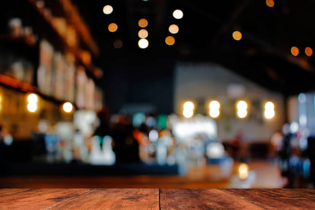 wood table with blur of people in cafe or restaurant on background. - home decoration stock pictures, royalty-free photos & images