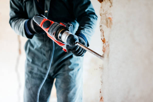 worker using pneumatic hammer drill to cut the wall concrete brick, close up - home decoration stock pictures, royalty-free photos & images