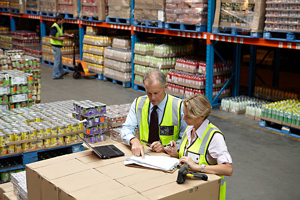 workers in a food distribution warehouse - food fotografías e imágenes de stock
