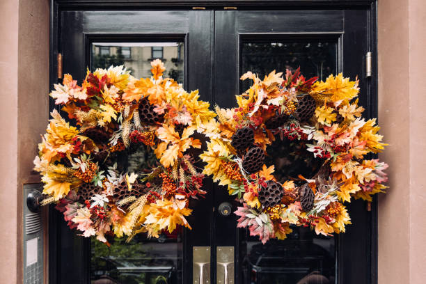 wreath made of autumn leaves on the townhouse door, close-up - home decoration stock pictures, royalty-free photos & images