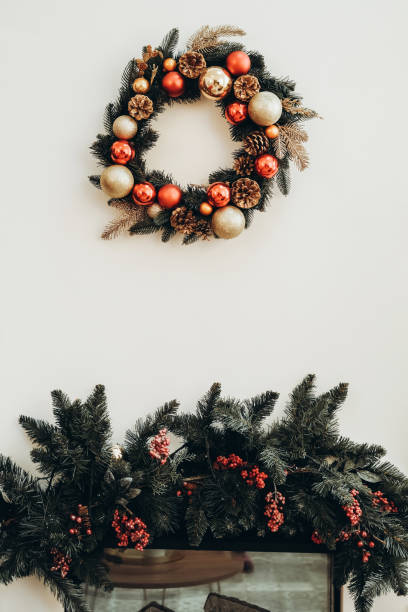 xmas wreath with cones and toys over branches with berries. - home decoration stock pictures, royalty-free photos & images