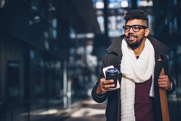 young adult commuter going at work - junk food stock pictures, royalty-free photos & images
