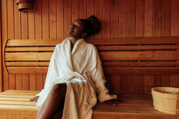 young black woman enjoying in sauna. - travel stock pictures, royalty-free photos & images