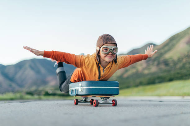 young boy ready to travel with suitcase - travel stock pictures, royalty-free photos & images