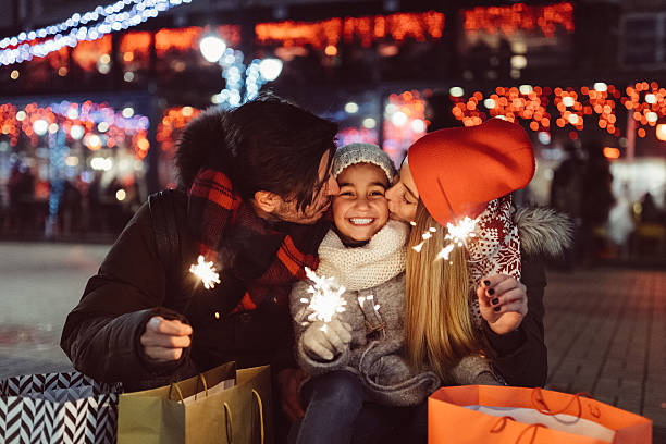 young family celebrating christmas - travel stock pictures, royalty-free photos & images