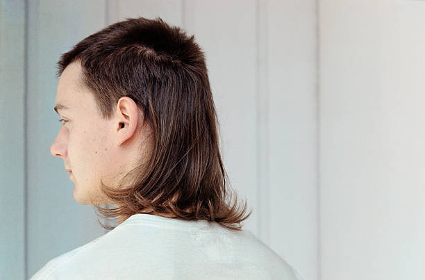 young man with mullet - hairstyle stock-fotos und bilder