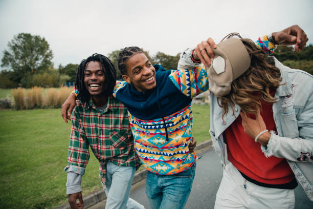 young men hanging out in the park - concert stock pictures, royalty-free photos & images
