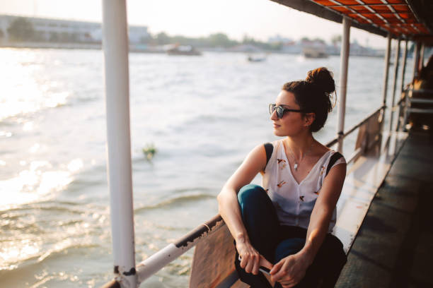 young tourist woman riding on the bangkok ferry boat - travel stock pictures, royalty-free photos & images