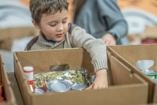 young volunteer - food stock pictures, royalty-free photos & images