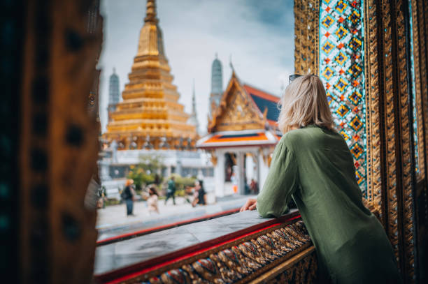 young woman exploring the grand palace in bangkok - travel stock pictures, royalty-free photos & images