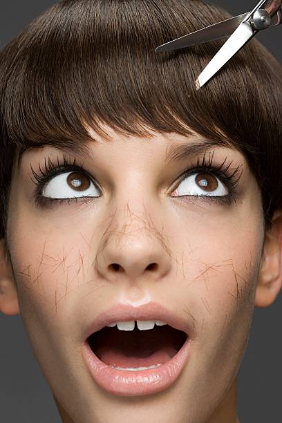 young woman having a haircut - hairstyle stock pictures, royalty-free photos & images