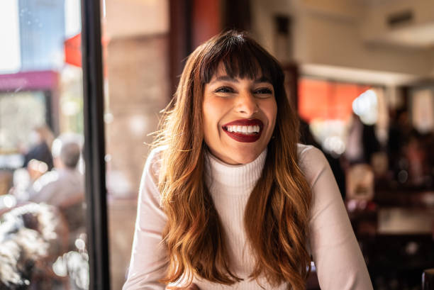 young woman in a cafeteria - hairstyle stock pictures, royalty-free photos & images