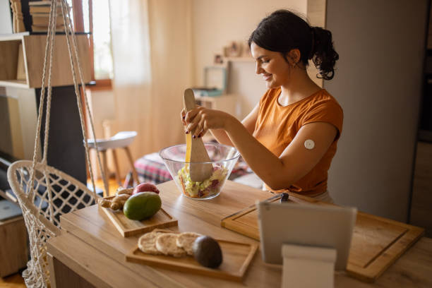 young woman preparing a healthy salad - food stock pictures, royalty-free photos & images