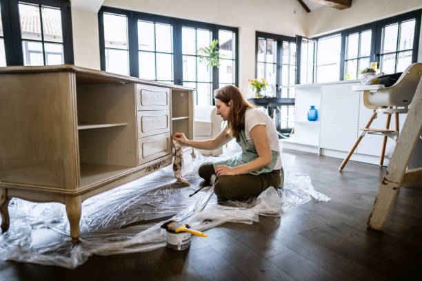young woman repairing an old furniture and enjoying at home - home decoration stock pictures, royalty-free photos & images