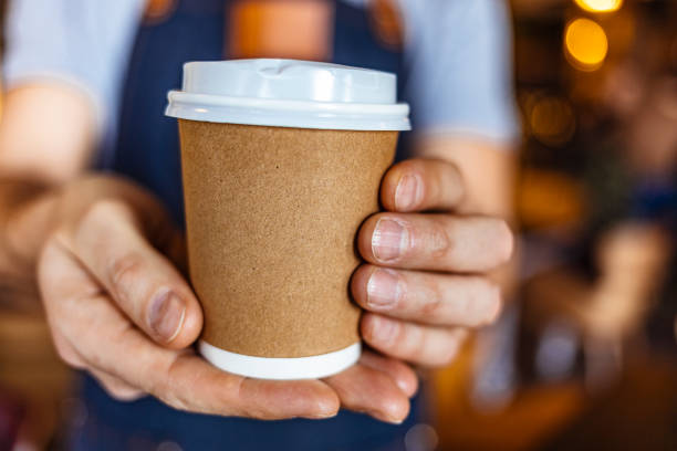 your take-away coffee is ready! - junk food stock pictures, royalty-free photos & images