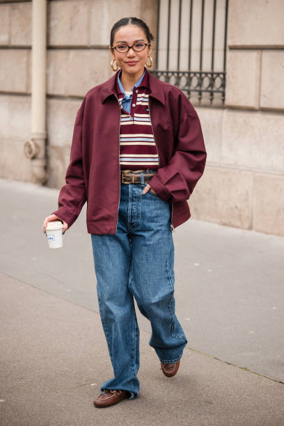 Yoyo Cao wears brown and white Miu Miu polo neck top, blue checked shirt, burgundy Miu Miu jacket, blue jeans, brown loafers, brown belt, outside Miu...