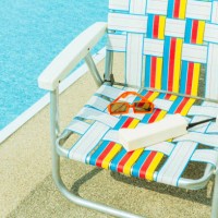 1980s summer background with brick phone, webbed lawn chair next to pool, 90s summer vacation - garden decoration photos et images de collection