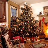 1990s Americana Theme Traditional Decorated Living Room Christmas Presents Under Tree Fireplace With Stocking Wing Chair