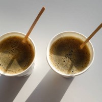 2 paper cup boxes are on the table in the cafe. coffee to go. morning. - junk food stock pictures, royalty-free photos & images