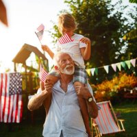4th of july - grandfather and grandson - garden decoration stock pictures, royalty-free photos & images