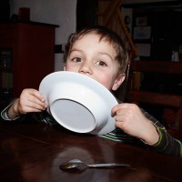 5 year old boy licking his plate - food stock pictures, royalty-free photos & images