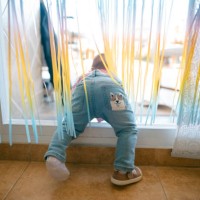 a baby trying to get out on the terrace - home decoration stock pictures, royalty-free photos & images