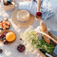 a beautiful young woman is having a good time on the beach on a picnic. a sunny summer day. - fashion stock pictures, royalty-free photos & images