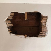a big hole on the wall in an abandoned building at vevey, switzerland - home decoration stock pictures, royalty-free photos & images
