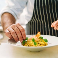a chef is plating spaghetti - food stock pictures, royalty-free photos & images