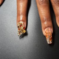a close-up of a manicured hand and chandelier nails - nails art stock pictures, royalty-free photos & images