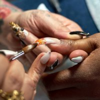 a close-up of a nail artist creating a chandelier nail manicure - nails art stock pictures, royalty-free photos & images