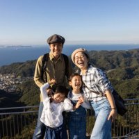 a family climbing a mountain in a travel destination. - travel stock pictures, royalty-free photos & images