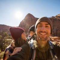 a family taking a selfie while hiking a scenic trail - travel stock-fotos und bilder