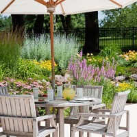 a garden patio with big white umbrella - home decoration stock pictures, royalty-free photos & images