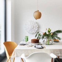 a gingerbread cake stands on a table decorated in a modern, christmassy way - home decoration stock pictures, royalty-free photos & images