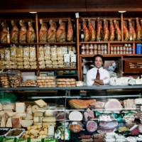 a grocer behind his counter in his shop - food stock pictures, royalty-free photos & images