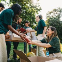 a group of people are working together at a food and clothes bank - food stock pictures, royalty-free photos & images