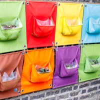 a hanging garden on a wall - garden decoration stock pictures, royalty-free photos & images