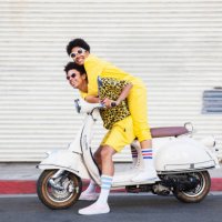 a hip young couple on a scooter - travel stock pictures, royalty-free photos & images