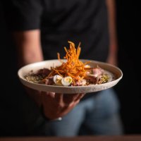 a male chef serving a fine dining dish in a restaurant - food stock pictures, royalty-free photos & images