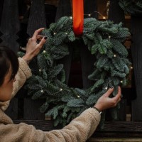 a natural setup with christmas pine wreaths outside a wooden house - home decoration stock pictures, royalty-free photos & images