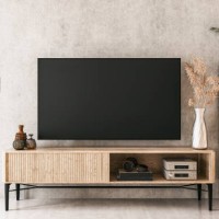 a nostalgic retro living room with a tv on a cabinet and book shelves in front of a textured ruined gray plaster wall - home decoration stock pictures, royalty-free photos & images