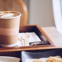a paper cup containing hot coffee in coffee shop. - junk food stock pictures, royalty-free photos & images