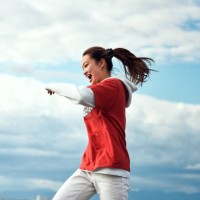 a person who dances against the blue sky. - fashion stock pictures, royalty-free photos & images