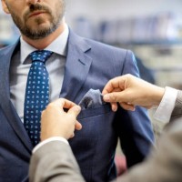 a personal stylist helping his customer - fashion stock pictures, royalty-free photos & images